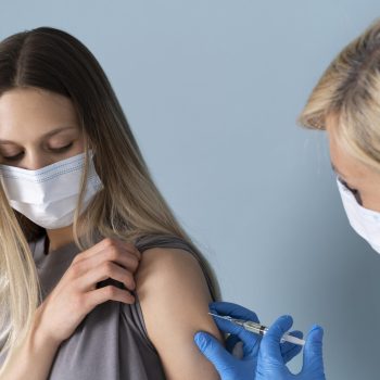 female-patient-with-medical-mask-getting-vaccine